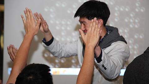 ECE student Shang Wang celebrates winning top prize at the Connect6 game competition.