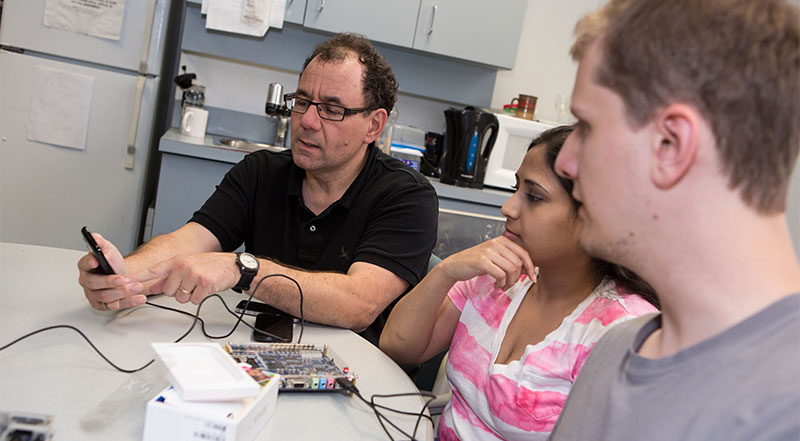Professor Jonathan Rose works with students.