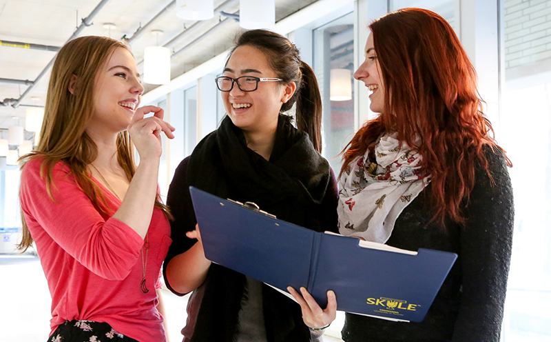From left: Julia Filiplic, Christine Bui and Molly Gorman are among the 30.6 per cent of first-year engineering students at U of T who are female — the highest percentage in Ontario (Photo: Roberta Baker).
