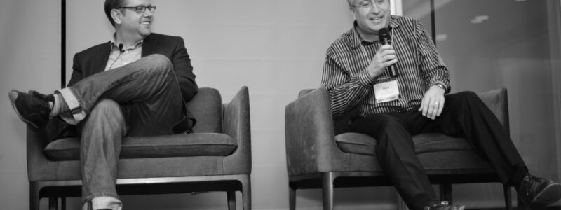 Karl Martin, left, laughs with David Schie during the conversation at The Heart of the Matter: The Future of Wearable Technology.