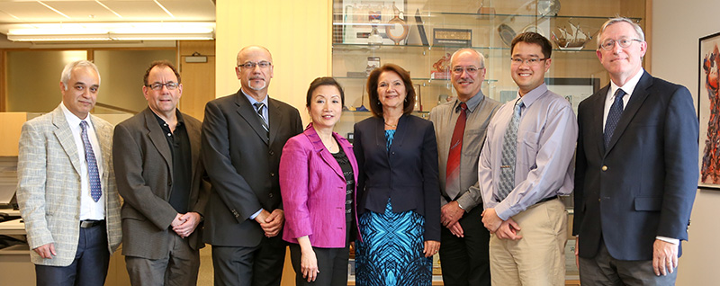 From left: Mike Mehramiz, Jonathan Rose, department chair Farid Najm, Belinda Li, dean Cristina Amon, Jaro Pristupa, Joe Wong and Frank Kschischang.