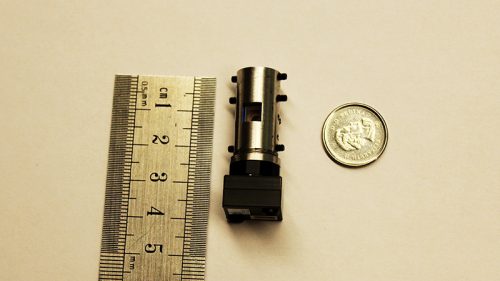 The team’s miniature microscope is approximately the size of a AAA battery. This novel design could pioneer wireless, implantable devices that create ‘early warning’ systems for patients with epilepsy or other brain diseases. (Photo: Luke Ng / University of Toronto)