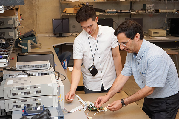 Professor Ali Sheikholeslami and student.