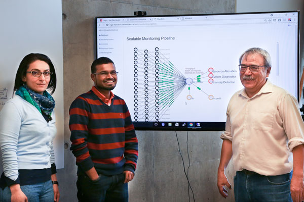 Professor Alberta Leon-Garcia (ECE), seen here with graduate students Atoosa Nasiri (left, ECE PhD candidate) and Rajsimman Ravichandiran (centre, ECE MASc candidate), heads the new NSERC Collaborative Research and Training Experience program in Network Softwarization. (Photo: Tyler Irving)