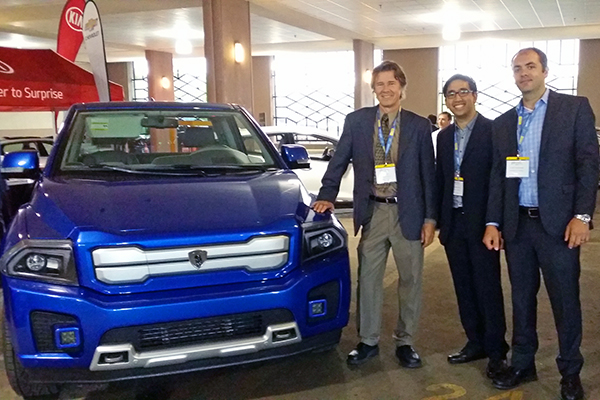 From left: UTEV’s Professor Peter Lehn, Dr. Theo Soong, and Professor Olivier Trescases (all ECE) at the Electric Mobility Canada Show with Havelaar’s electric pick-up truck, the Bison. (Credit: Sonja Persram)