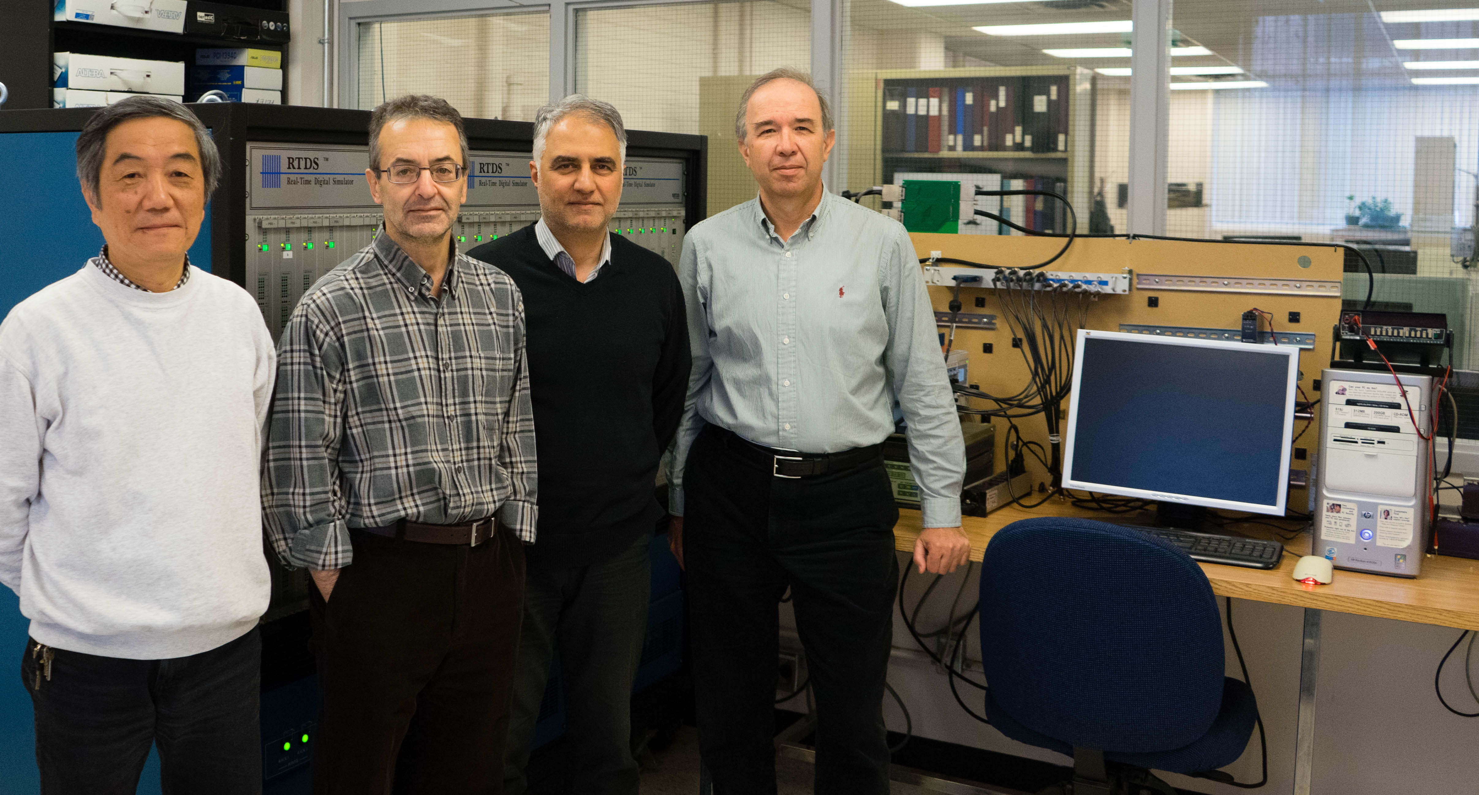 Professor Reza Iravani and members of his research group (from left, Mr. Xiaolin Wang, Professor Reza Iravani, Dr. Ali Nabavi and Dr. Milan Graovac) are helping to reduce range anxiety for electric vehicle drivers (Photo: Jessica MacInnis)
