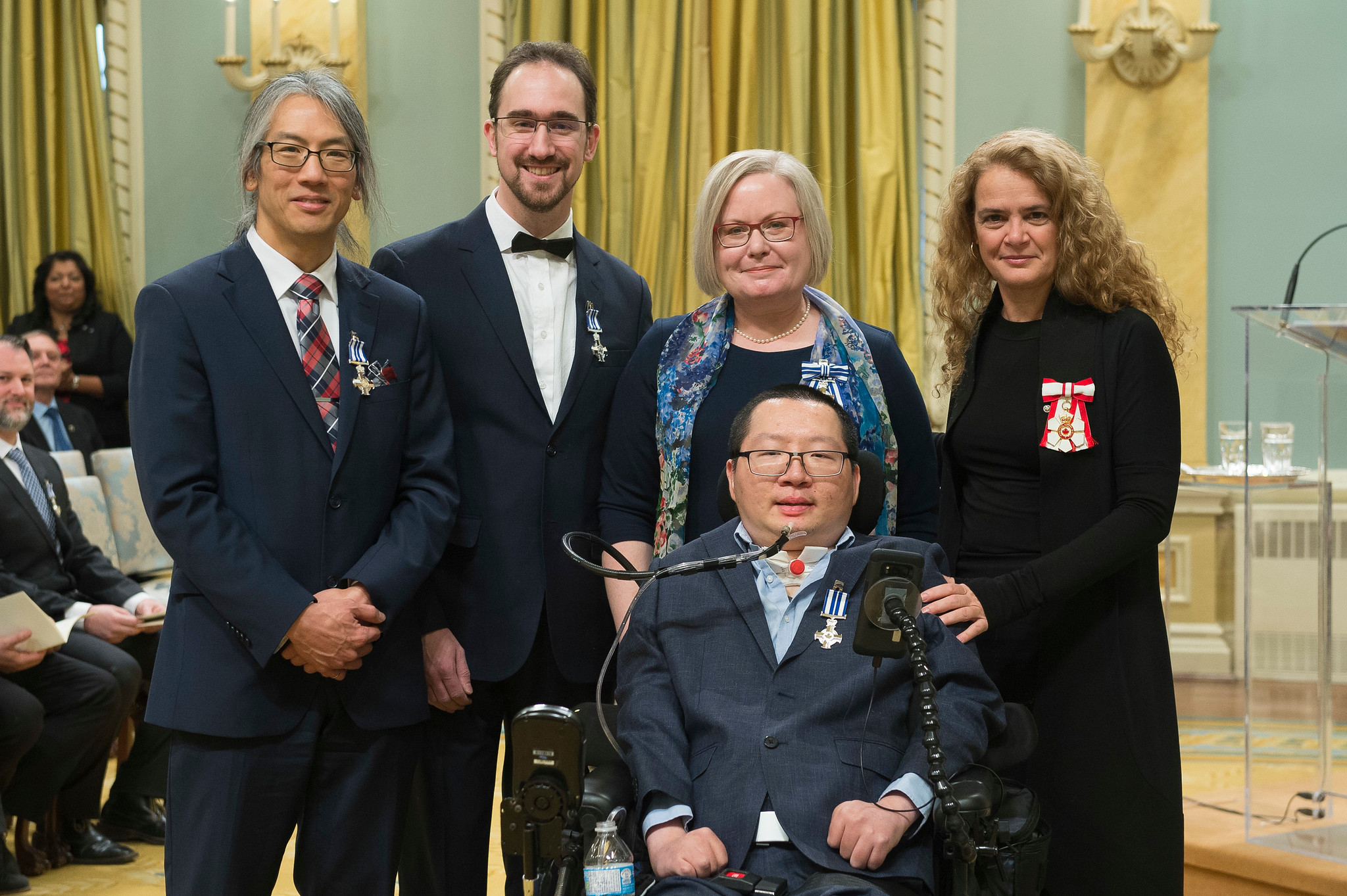 Her Excellency the Right Honourable Julie Payette (ECE MASc 9T0, at right) presents the Meritorious Service Cross to Professor Tom Chau (IBBME), Pierre Duez (EngSci 0T0, MASc IndE 0T3), Andrea Lamont, and Eric Wan (CompE 1T0, ECE MASc 1T3) on Tuesday, December 12, 2017, during a ceremony at Rideau Hall. (Credit: MCpl Vincent Carbonneau, Rideau Hall, OSGG)