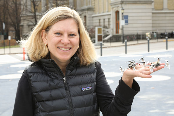 Mireille Broucke holds a drone