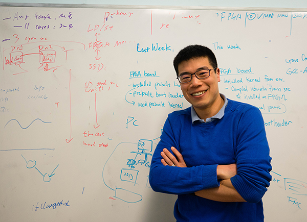 Professor Ding Yuan in front of whiteboard