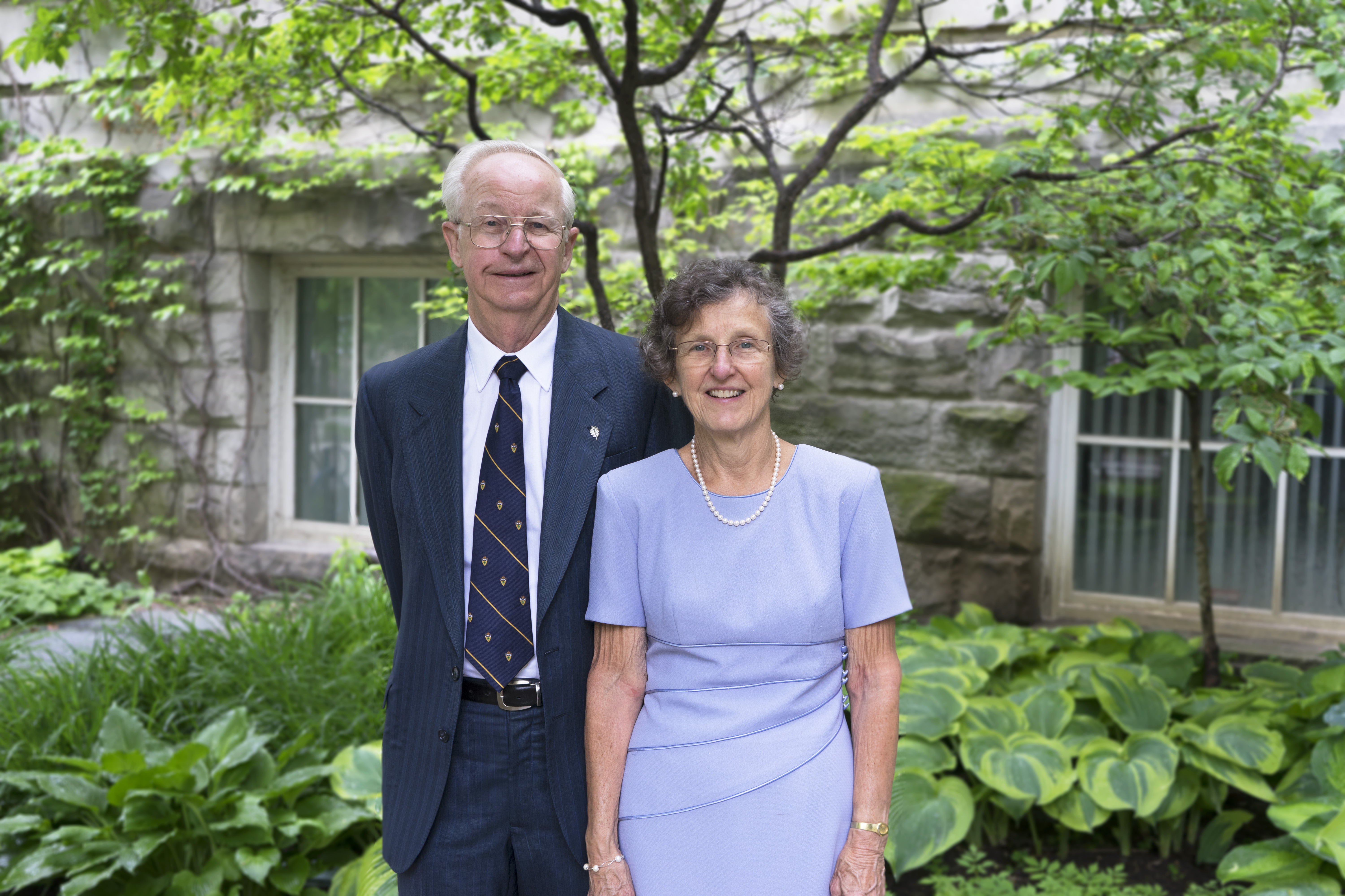 Donors Lauri and Jean Hiivala stand outside the Sandford Fleming Building at the University of Toronto