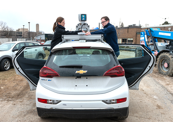 Mona Gridseth (left, UTIAS PhD candidate) and Keenan Burnett (EngSci 1T6+PEY, UTIAS MASc candidate) work on Zeus, a self-driving vehicle that recently took the top prize at the first competition of the three-year AutoDrive Challenge™. U of T Engineering’s new Engineering Science major in Machine Intelligence launches this September. It joins an MEng emphasis in Analytics that began January 2018. (Credit: Laura Pedersen)