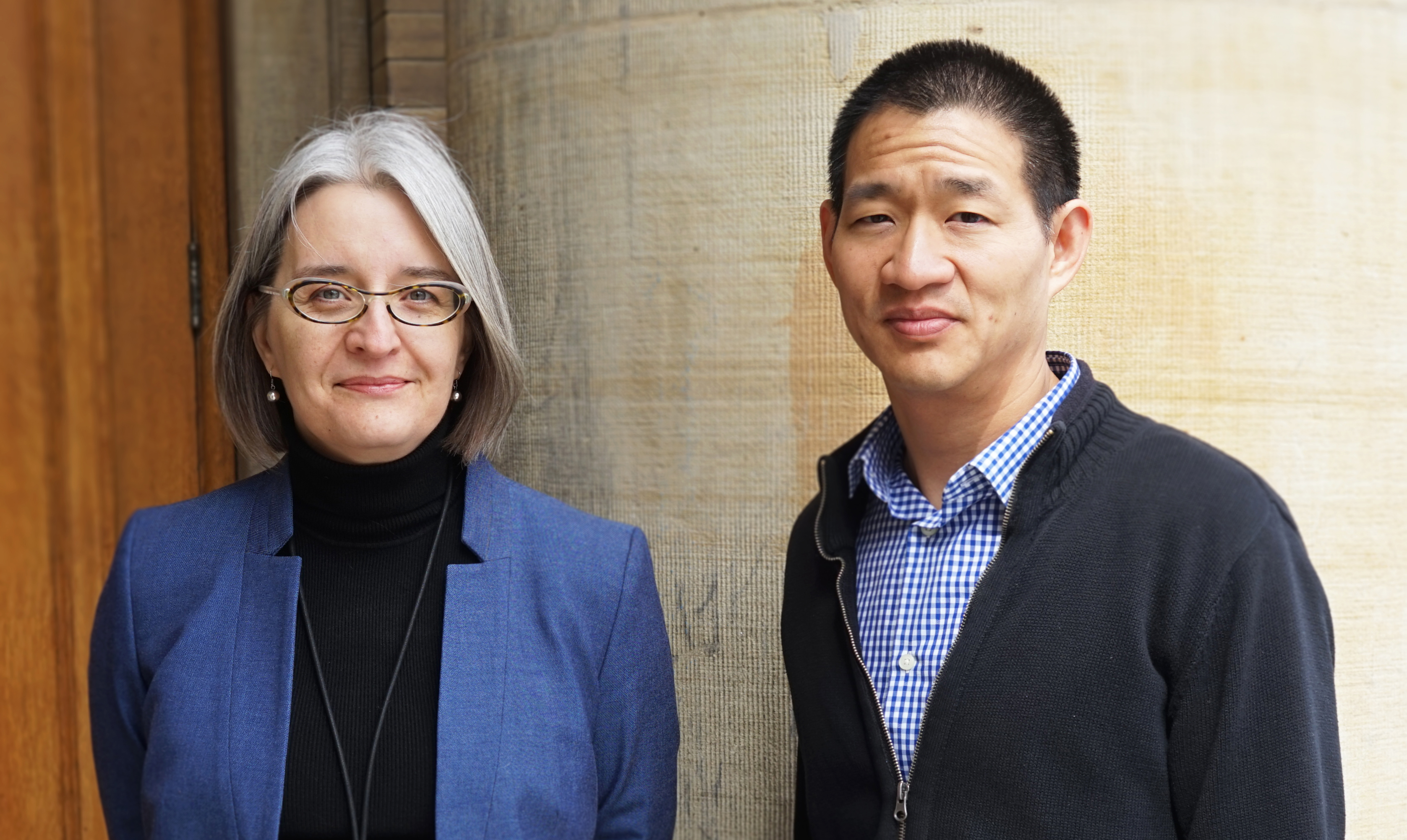 Professors Lisa Austin and David Lie photographed outside of Convocation Hall at the University of Toronto prior to when COVID-19 struck.