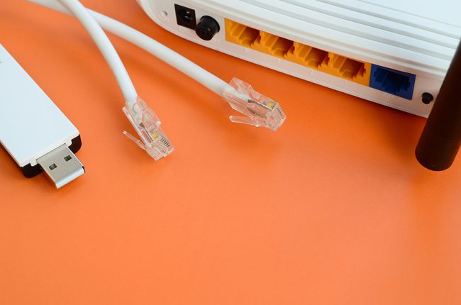Image of an internet router with ethernet cables unplugged.