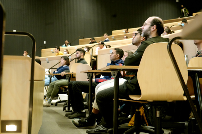 Audience faces turned to front in concentration