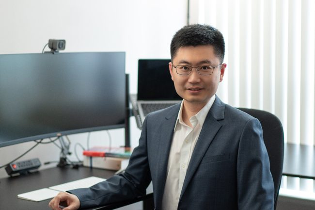 Professor sitting at desk