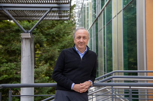 2-3-23-JJ-Garcia-Luna-Aceves-CL-006_650x430 Professor leaning on railing and smiling