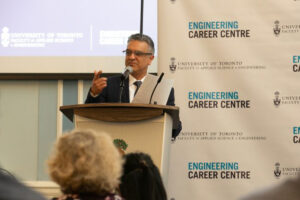 Man speaking at a lectern